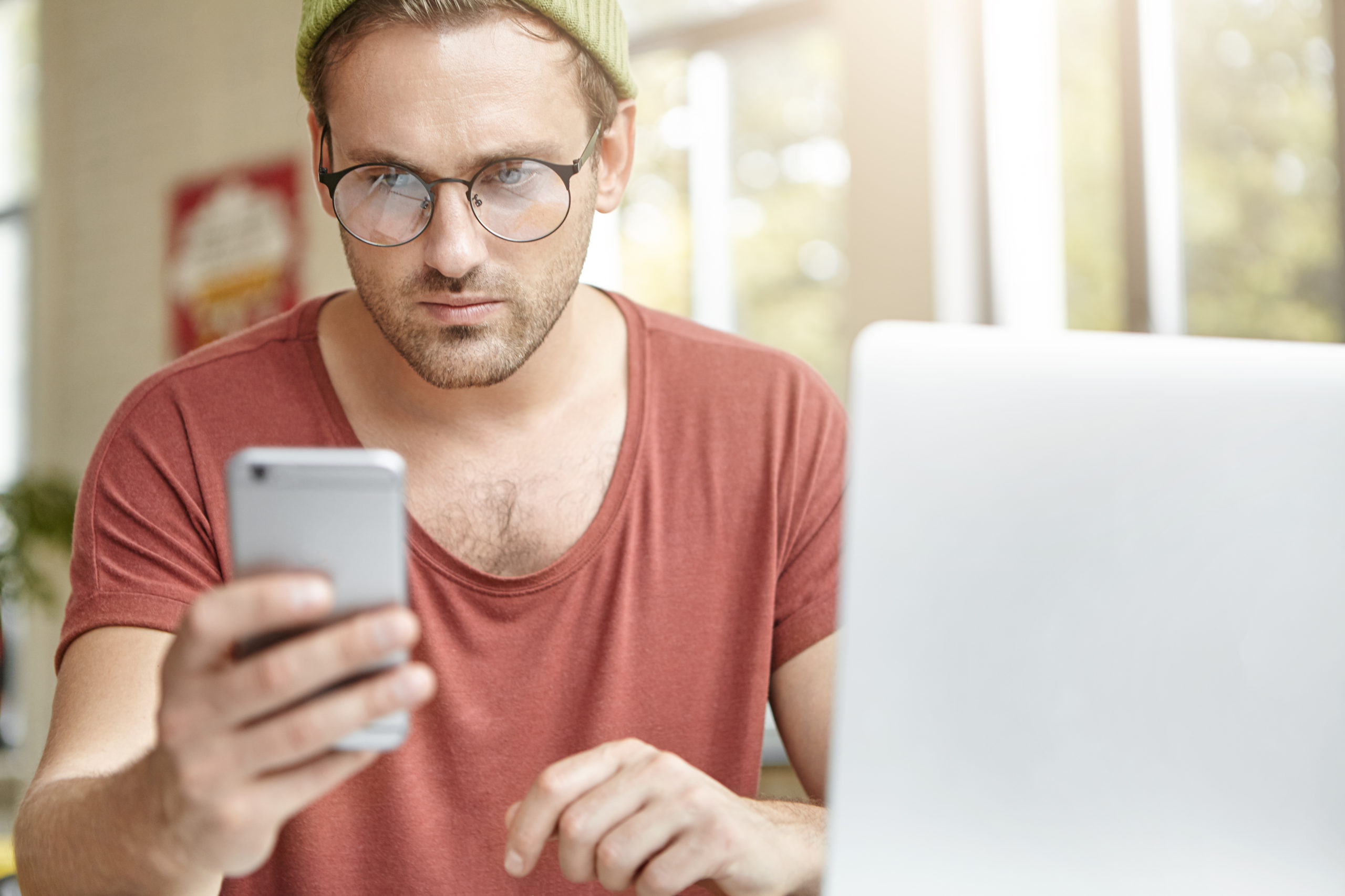 man looking at mobile phone